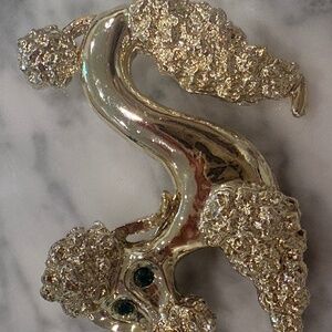Vintage goldtone Poodle Brooch Pin with green rhinestone eyes
